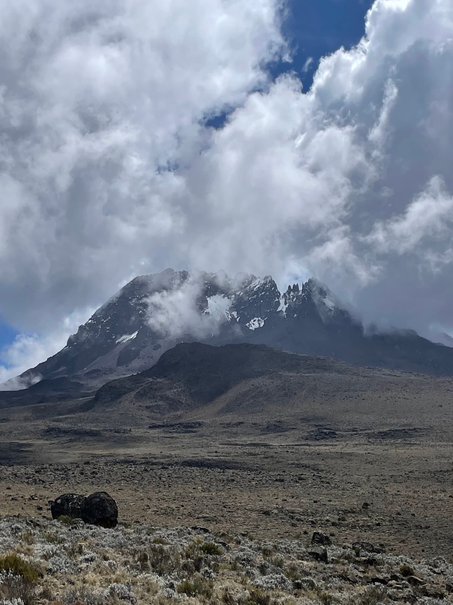 Mawenzi wrapped in cloud above the alpine desert of the Saddle